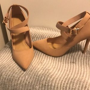 Woman’s Anne Michelle Tan high heels
